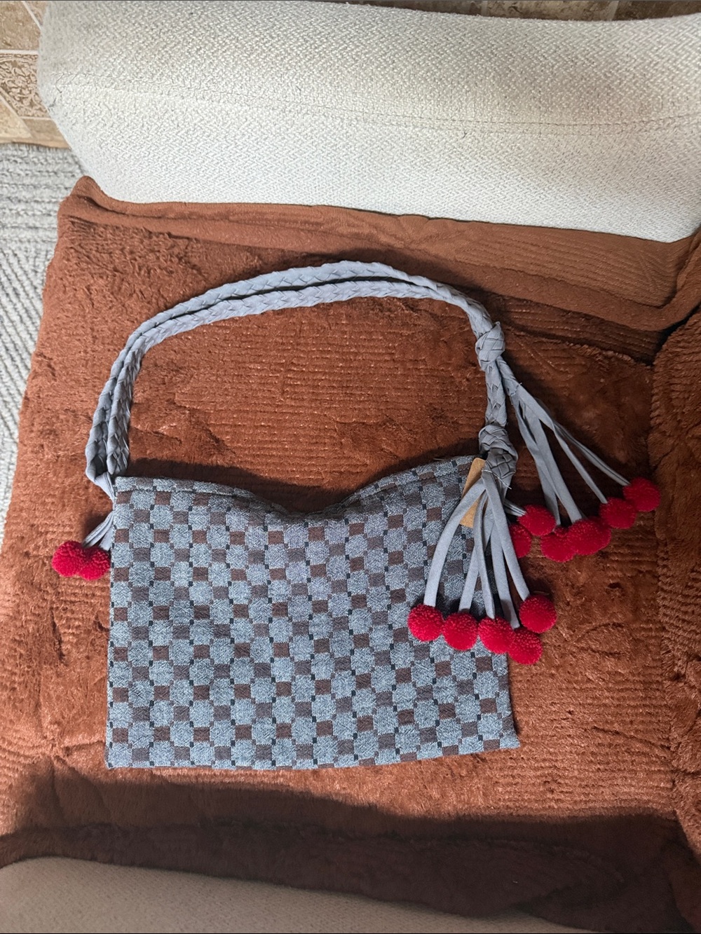 Gray Checkered Shoulder Bag with Red Pom Details